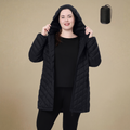 HHE plus size women's packable quilted coat in classic black, warm and comfortable functional outerwear, front view.
